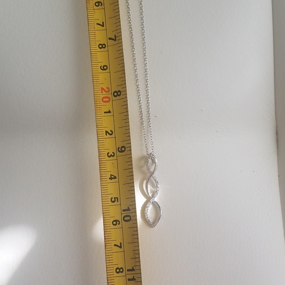 NWOT Silver tone rhinestone infinity loop necklace - Picture 3 of 3